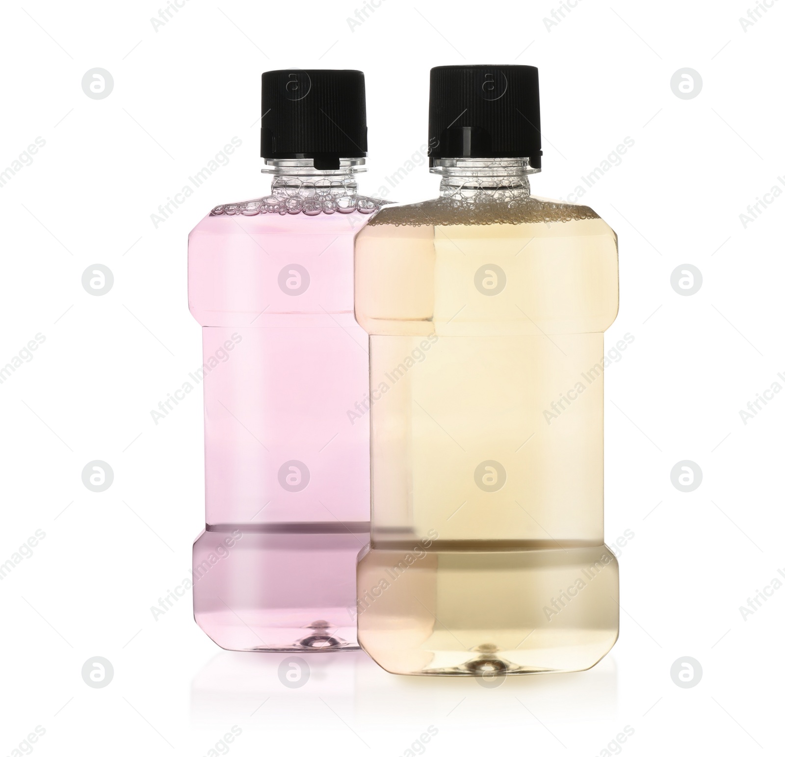 Photo of Bottles with mouthwash for teeth care on white background