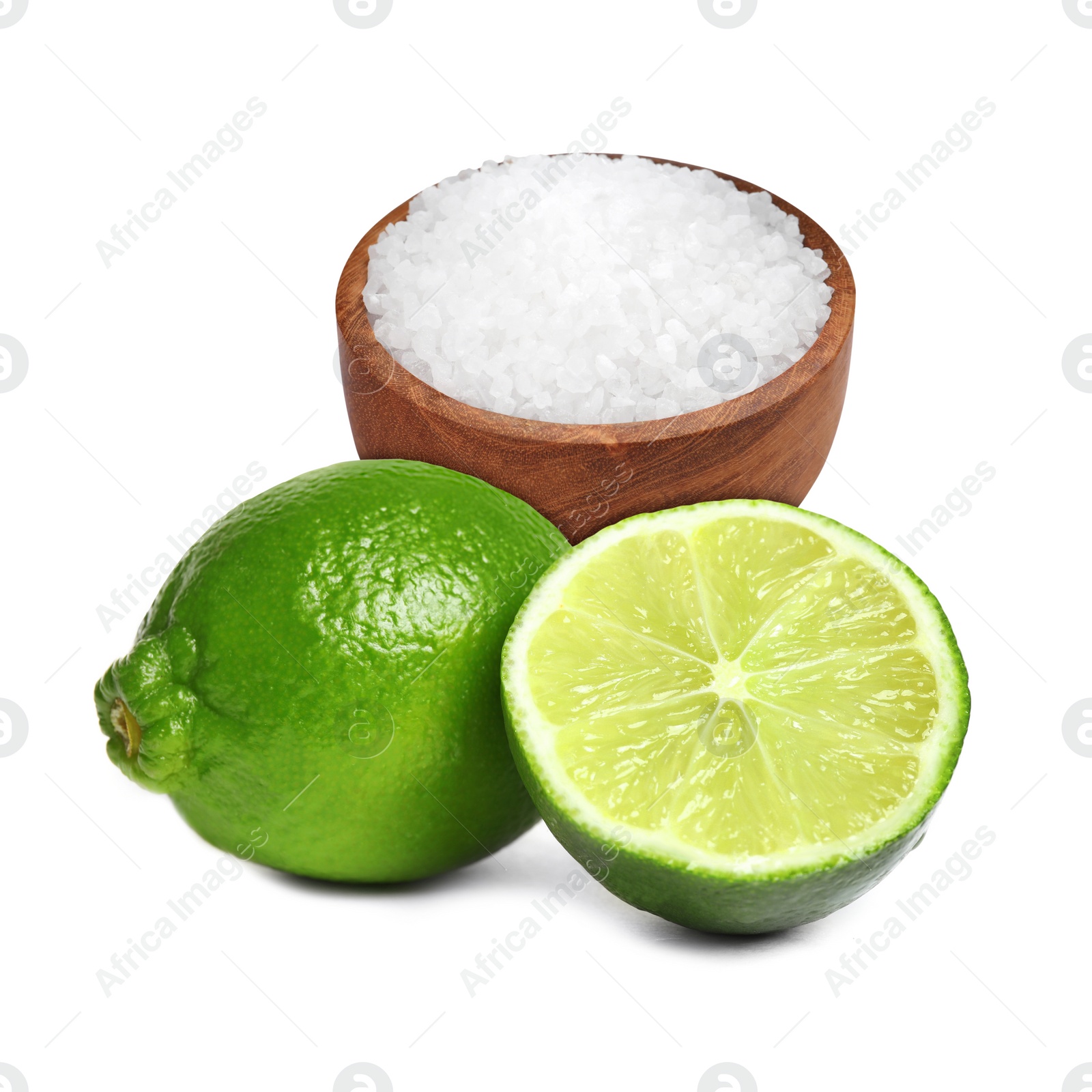 Image of Limes and salt isolated on white. Margarita cocktail ingredients