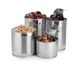 Photo of Tin cans with different kidney beans on white background