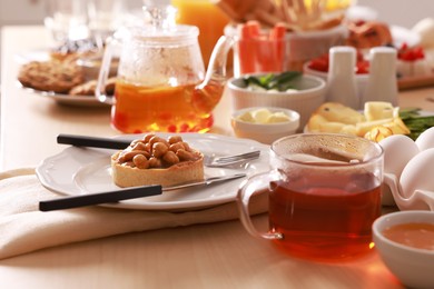 Photo of Dishes with different food on table indoors. Luxury brunch