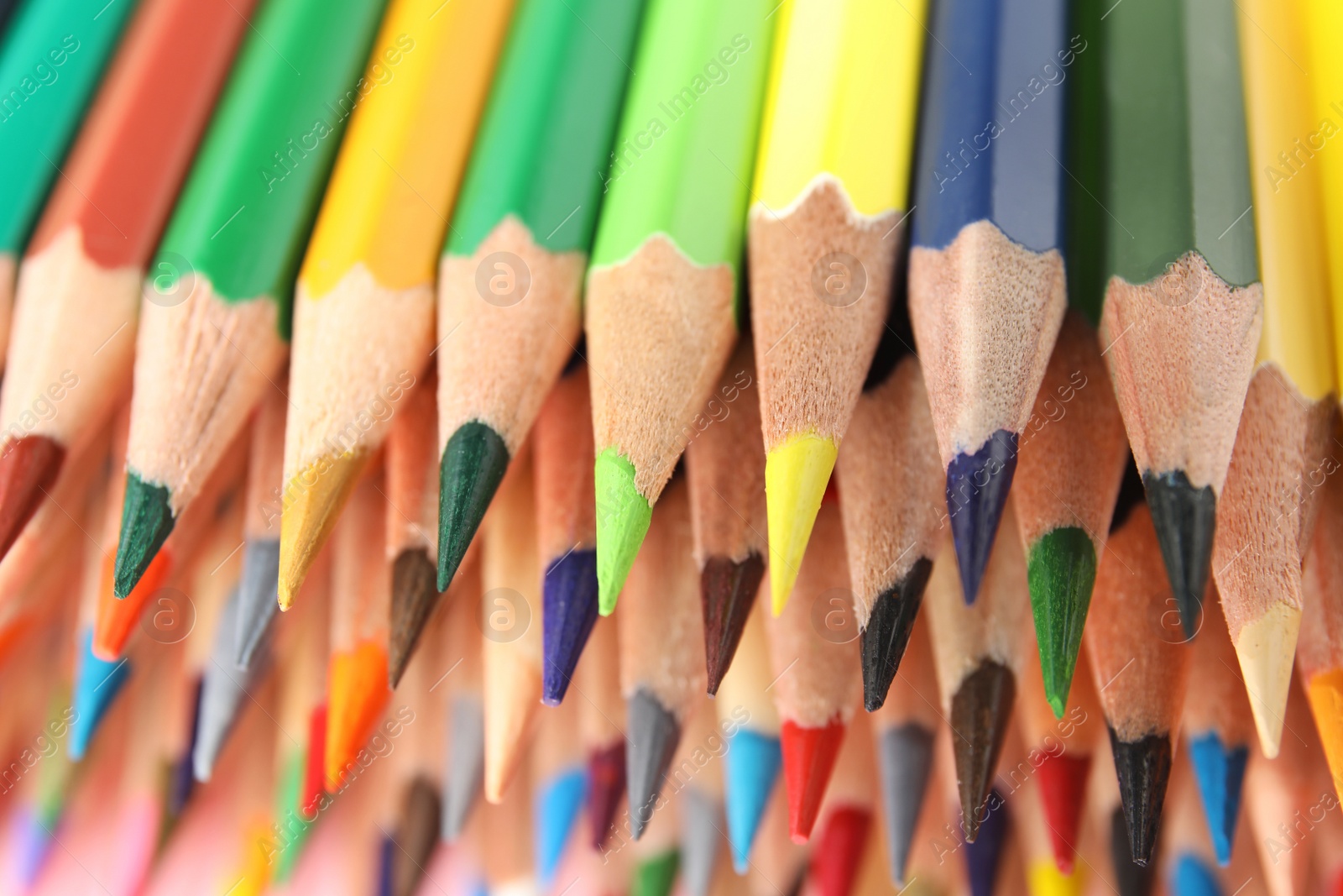 Photo of Different color pencils as background, closeup view