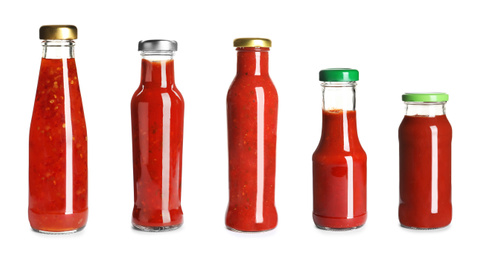 Image of Set with delicious sauces in glass bottles on white background. Banner design