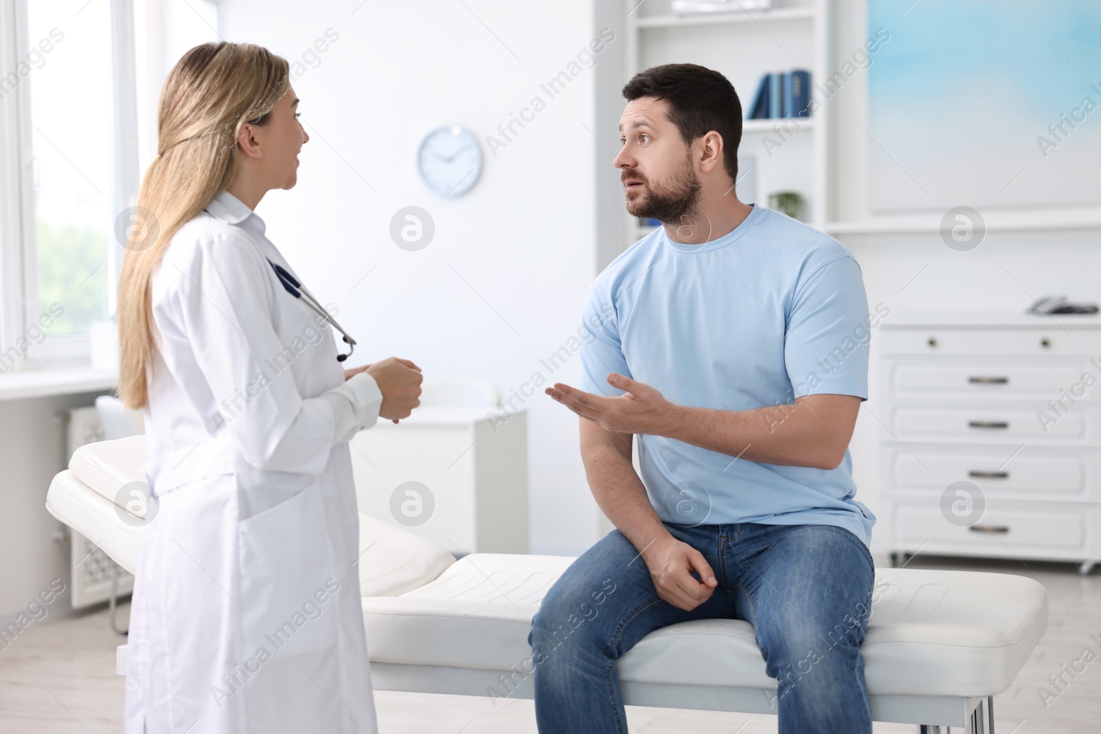 Photo of Professional doctor working with patient in hospital