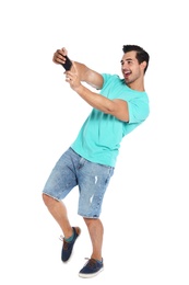 Photo of Happy young man taking selfie on white background