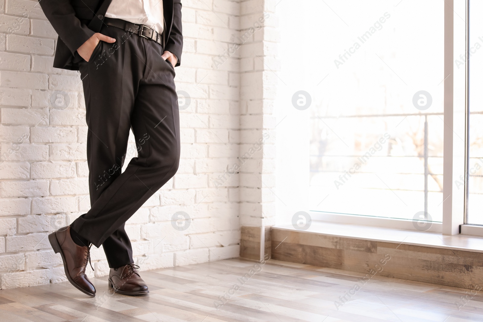 Photo of Man in elegant suit and leather shoes indoors, closeup