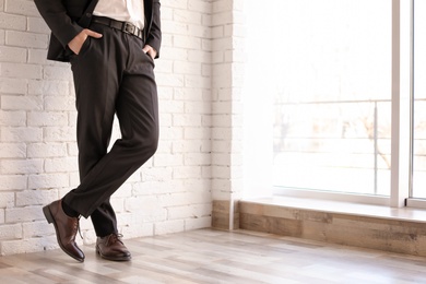 Photo of Man in elegant suit and leather shoes indoors, closeup