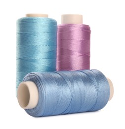 Photo of Different colorful sewing threads on white background