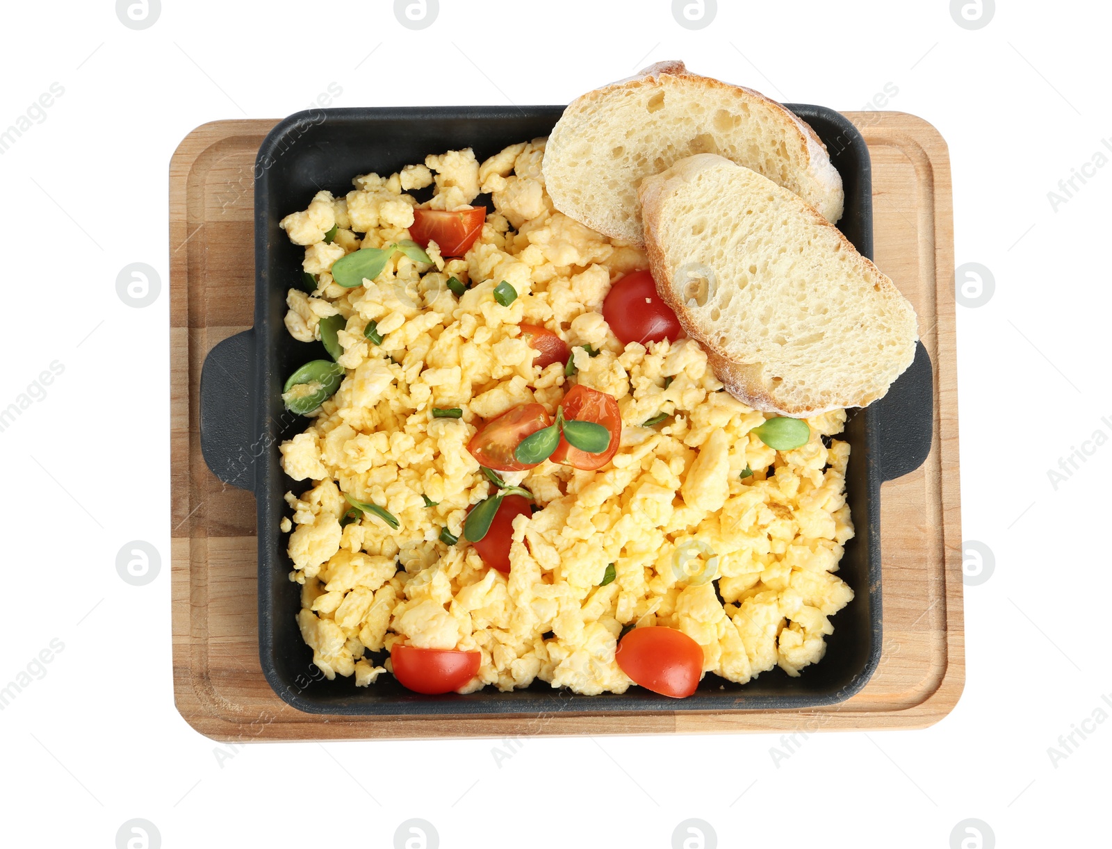 Photo of Tasty scrambled eggs with sprouts, cherry tomato and bread in frying pan isolated on white, top view