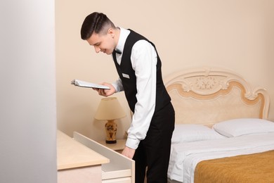 Photo of Man attending professional butler courses in hotel