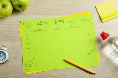 Photo of Flat lay composition with Meal Plan on wooden table