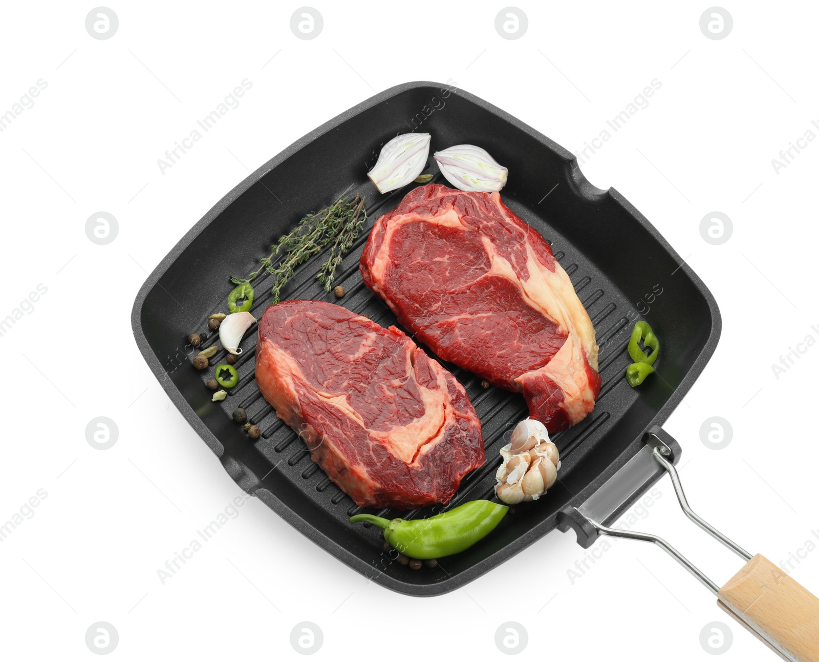 Photo of Grill pan with pieces of fresh beef meat, thyme and spices isolated on white