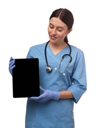 Doctor with stethoscope holding blank tablet on white background, space for design. Cardiology concept