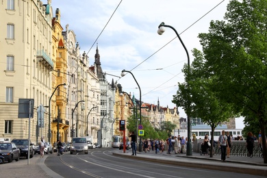 PRAGUE, CZECH REPUBLIC - APRIL 25, 2019: City street with beautiful buildings and road traffic