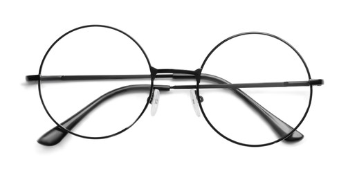 Photo of Round glasses with black frame on white background, top view