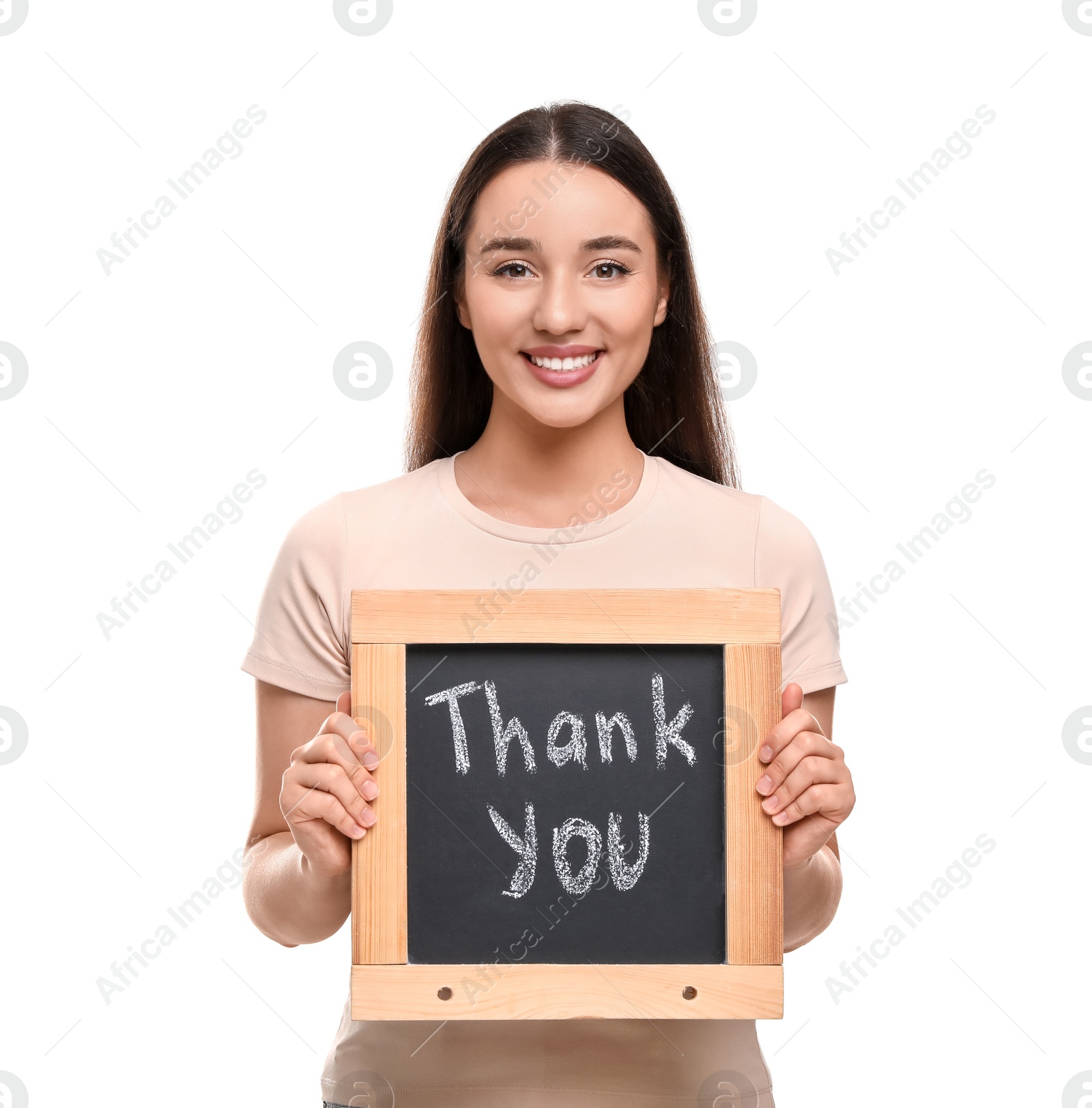 Photo of Happy woman holding small chalkboard with phrase Thank You on white background