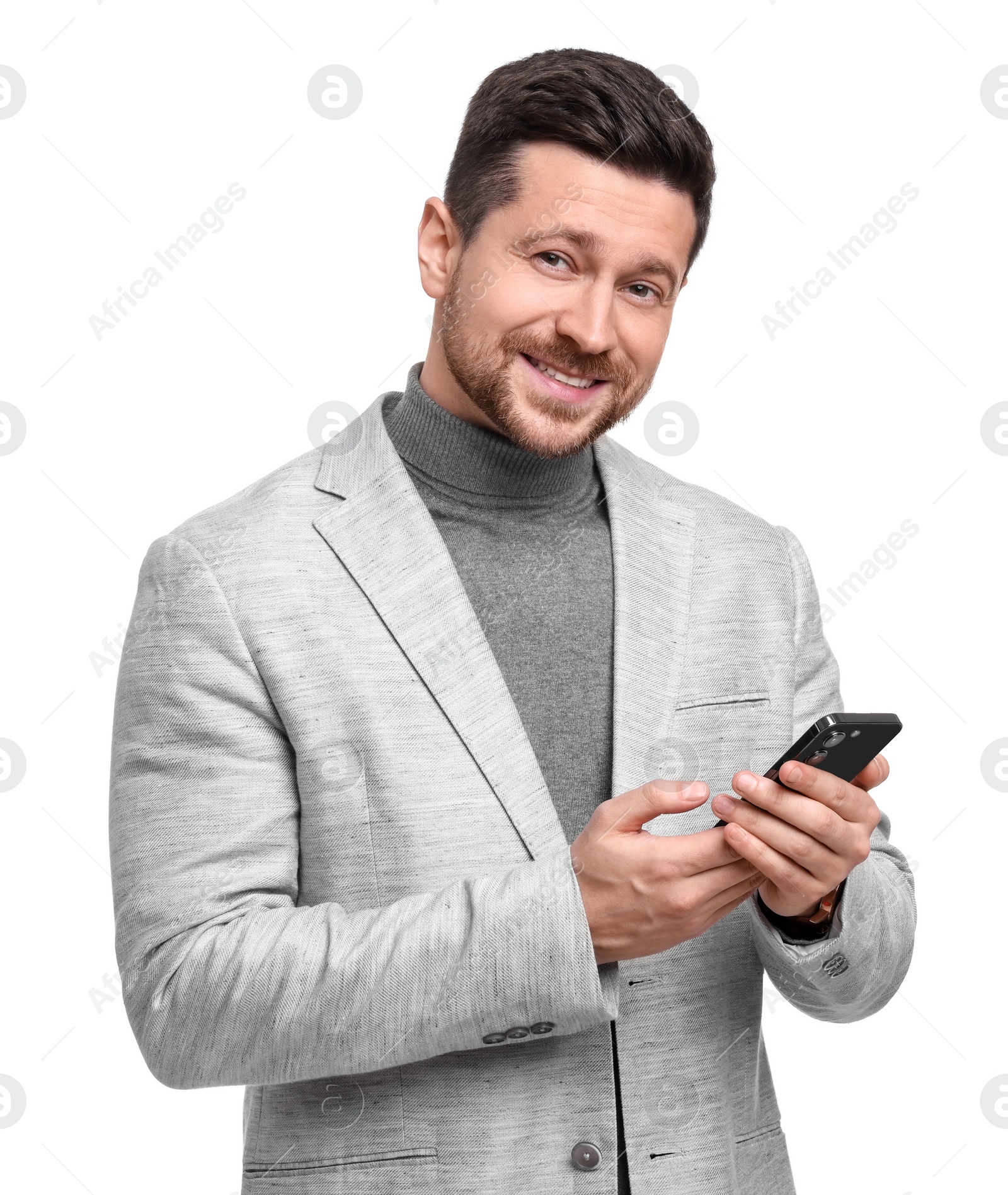 Photo of Handsome bearded businessman with smartphone on white background