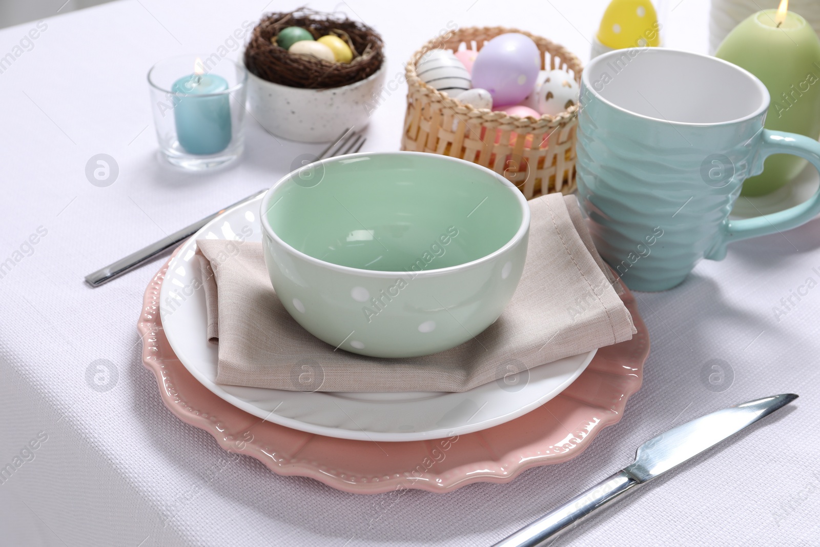 Photo of Festive table setting with elegant dishware. Easter celebration