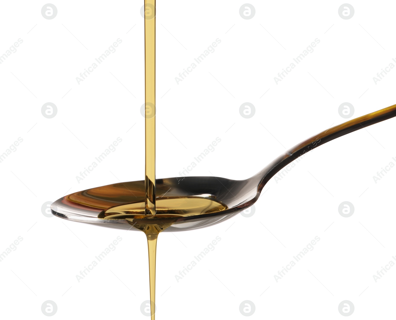 Photo of Pouring cooking oil into spoon on white background