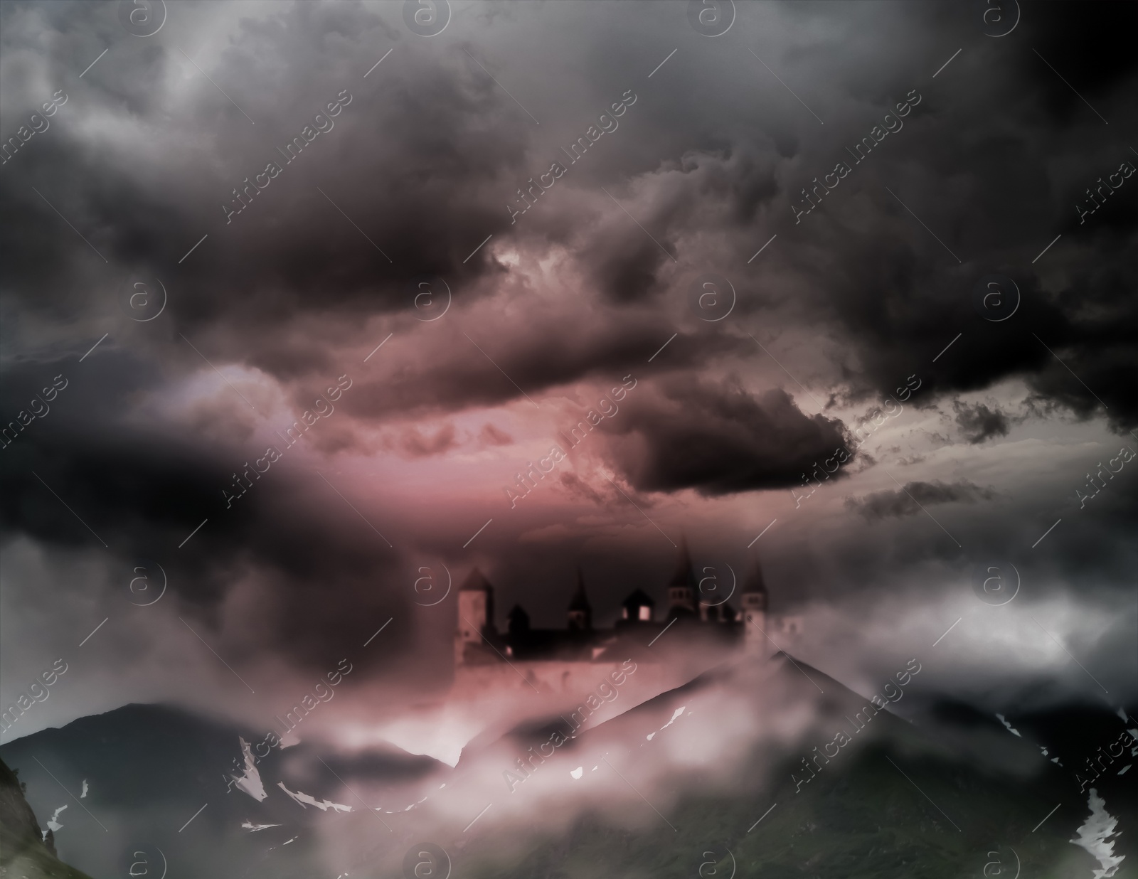 Image of Fantasy world. Mystical castle and mountains covering with fog in night