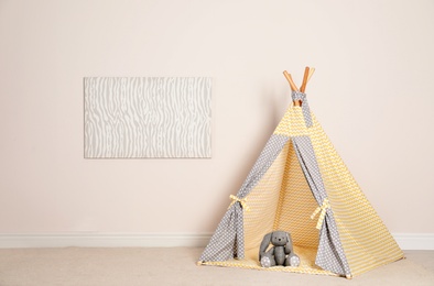 Photo of Cozy child room interior with play tent