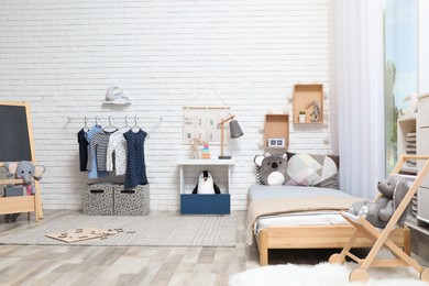 Photo of Montessori bedroom interior with floor bed and toys