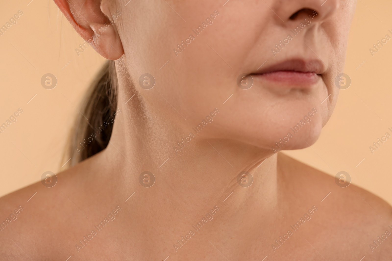 Photo of Woman with normal skin on beige background, macro view