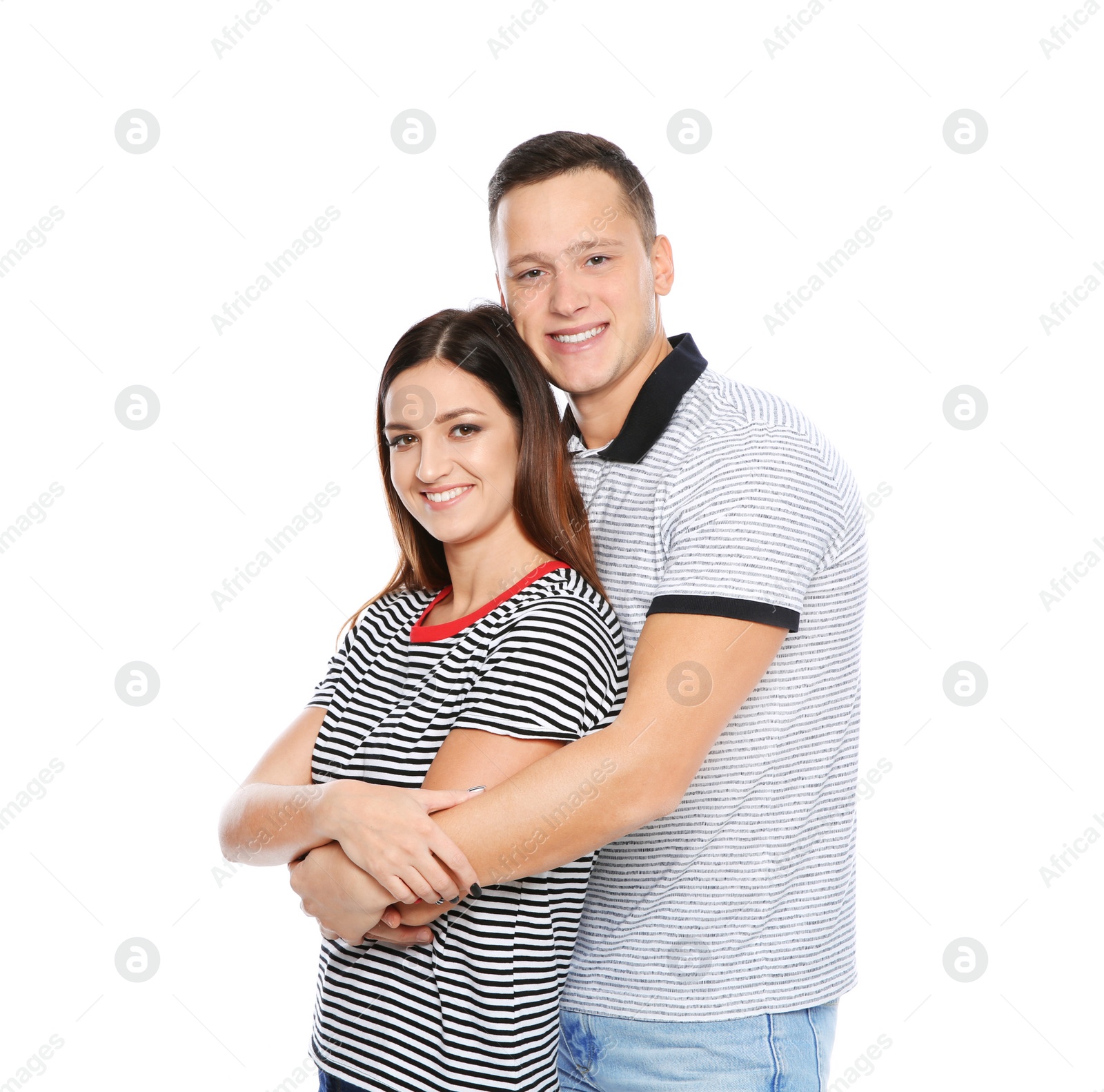 Photo of Portrait of cute young couple on white background