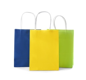 Photo of Mockup of paper shopping bags on white background