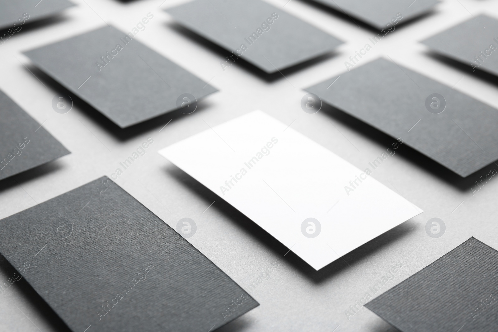 Photo of Blank business cards on light grey background, closeup. Mockup for design