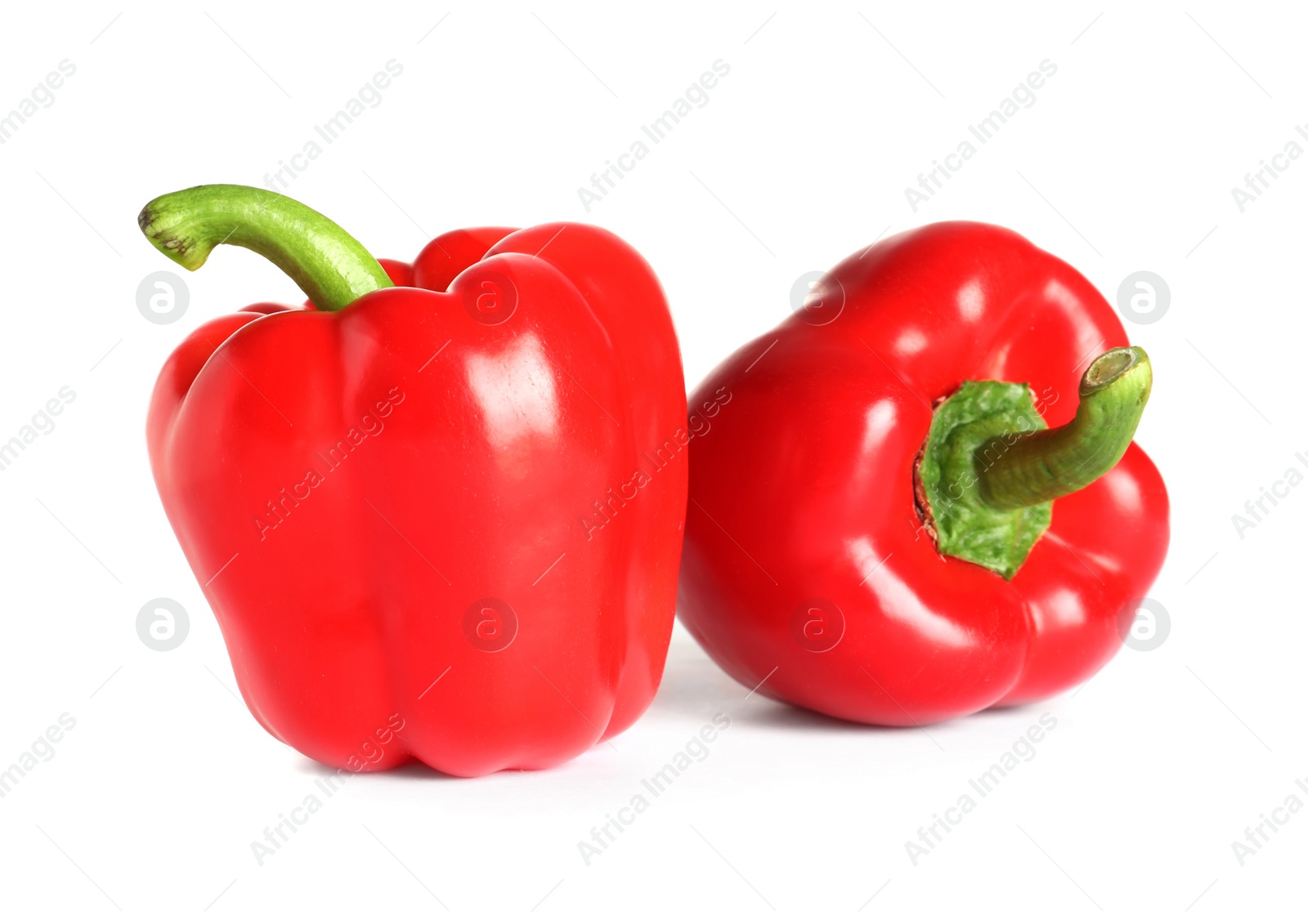 Photo of Tasty ripe red bell peppers on white background