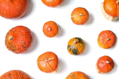 Photo of Flat lay composition with orange pumpkins on white background. Autumn holidays