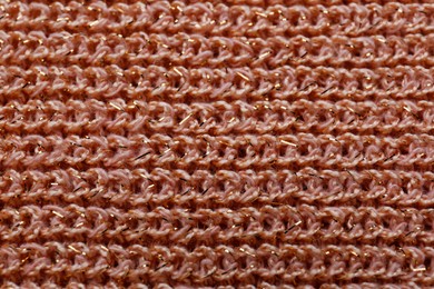 Photo of Brown knitted fabric as background, top view