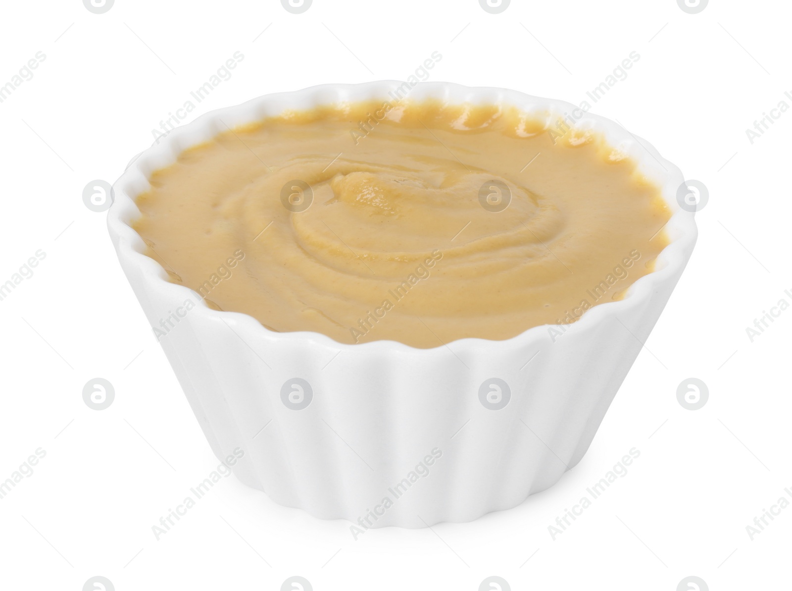 Photo of Fresh tasty mustard sauce in bowl isolated on white