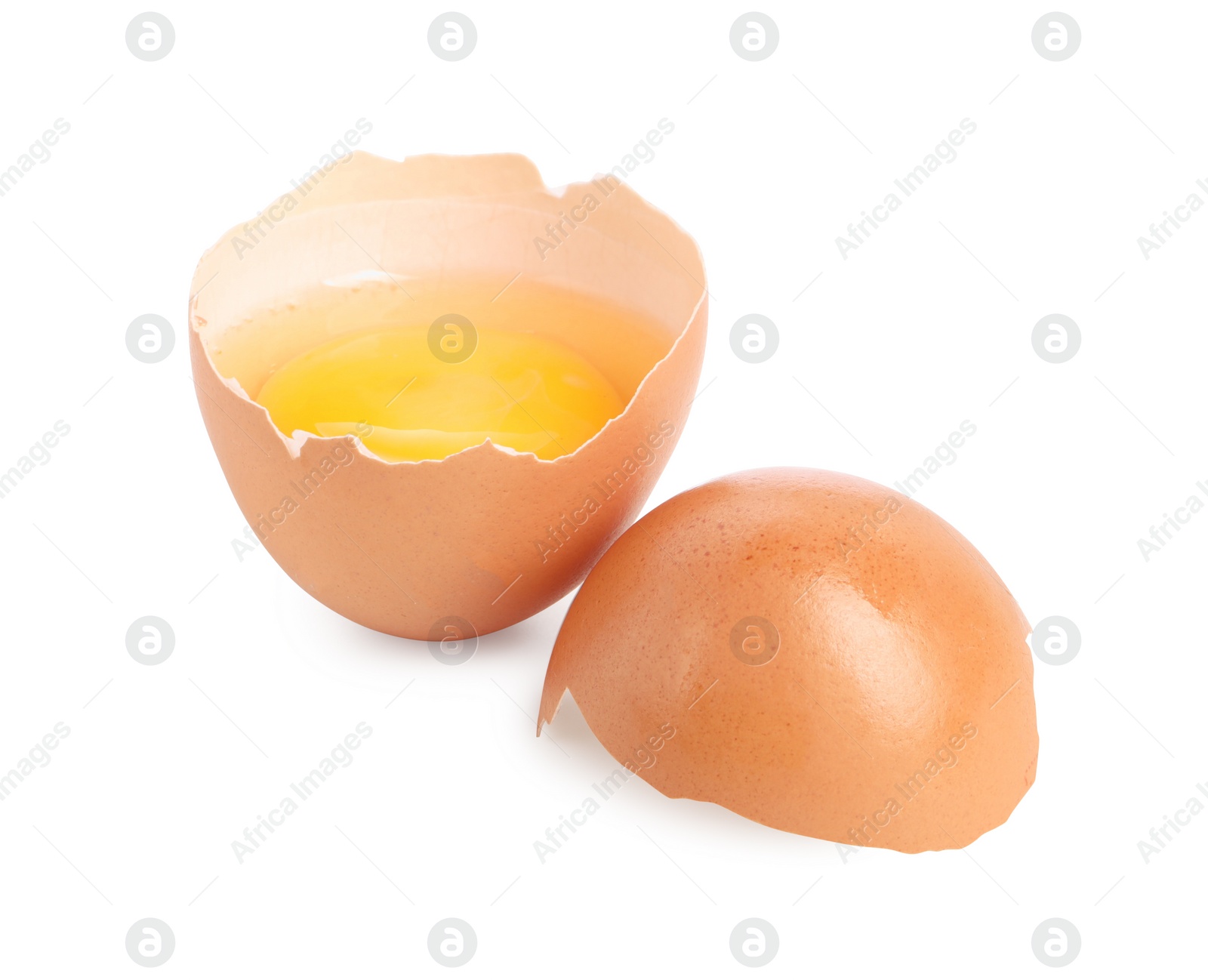 Photo of Cracked chicken egg with yolk isolated on white