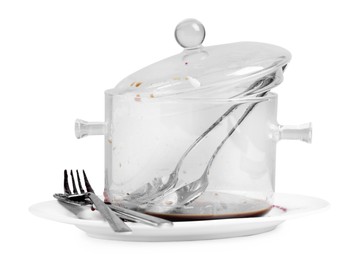 Dirty glass pot and cutlery on white background