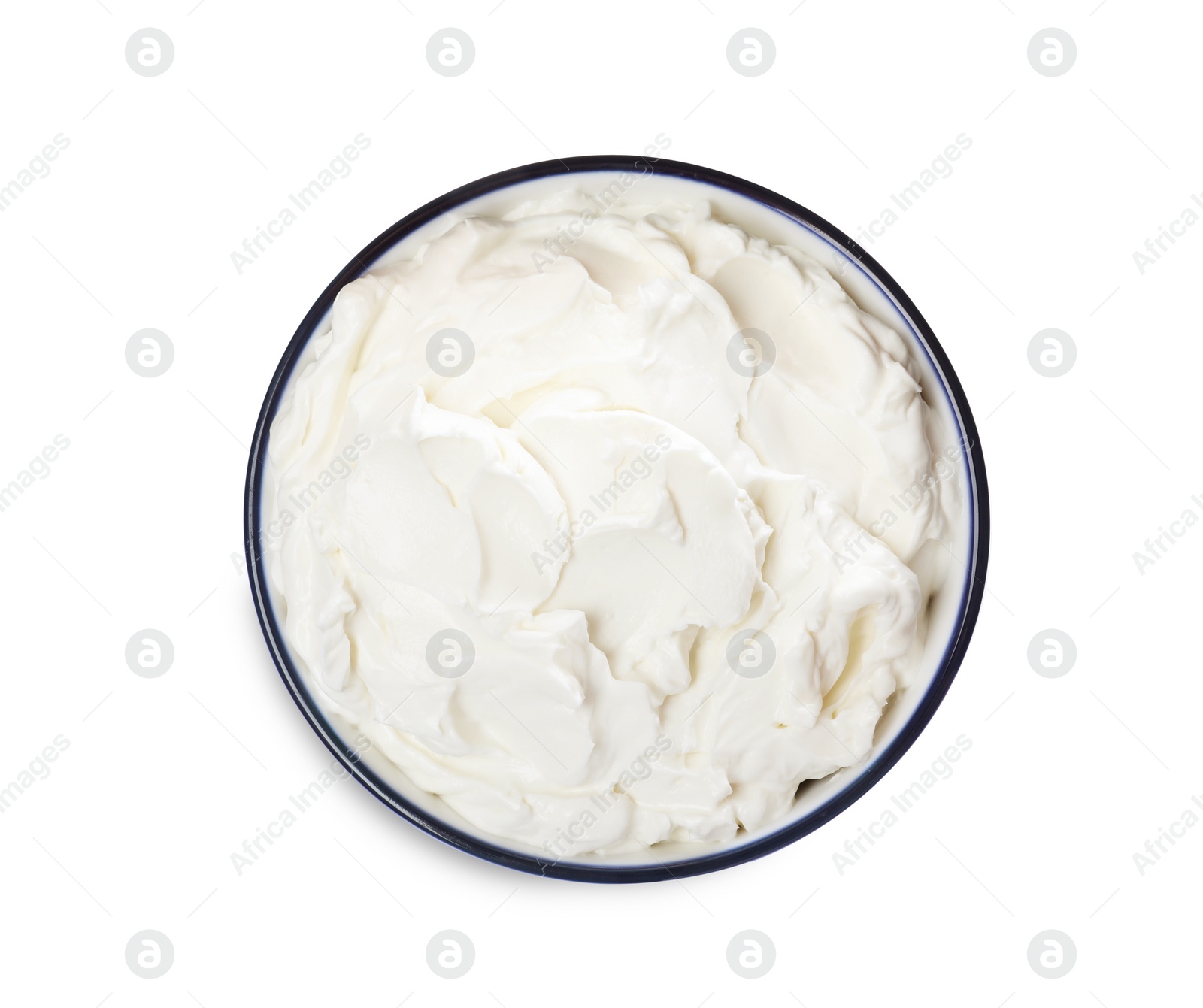 Photo of Bowl of tasty cream cheese isolated on white, top view