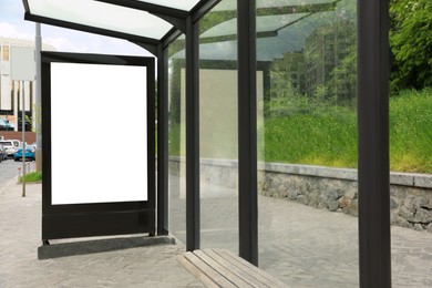 Photo of Blank advertising board on bus stop. Space for design