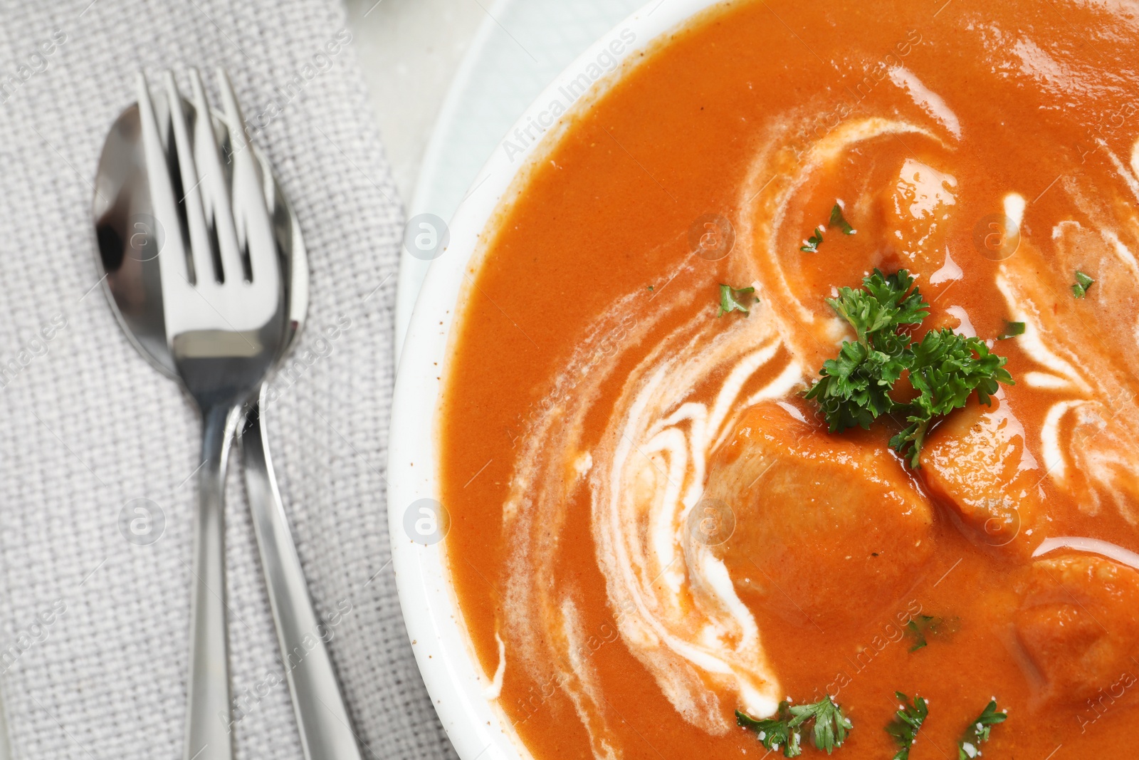 Photo of Delicious butter chicken served on table, top view. Traditional Murgh Makhani dish