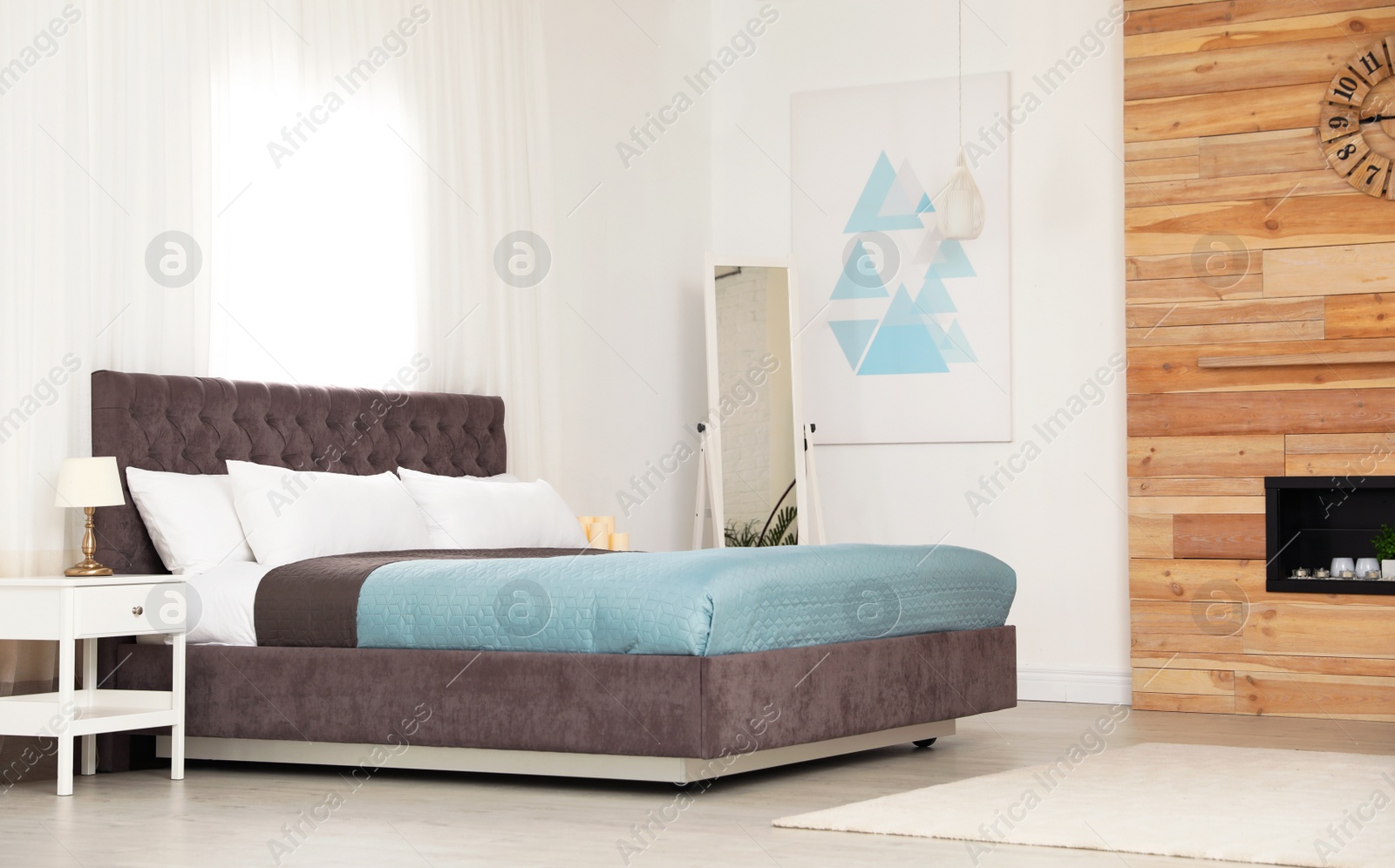 Photo of Modern comfortable bed in room. Interior design