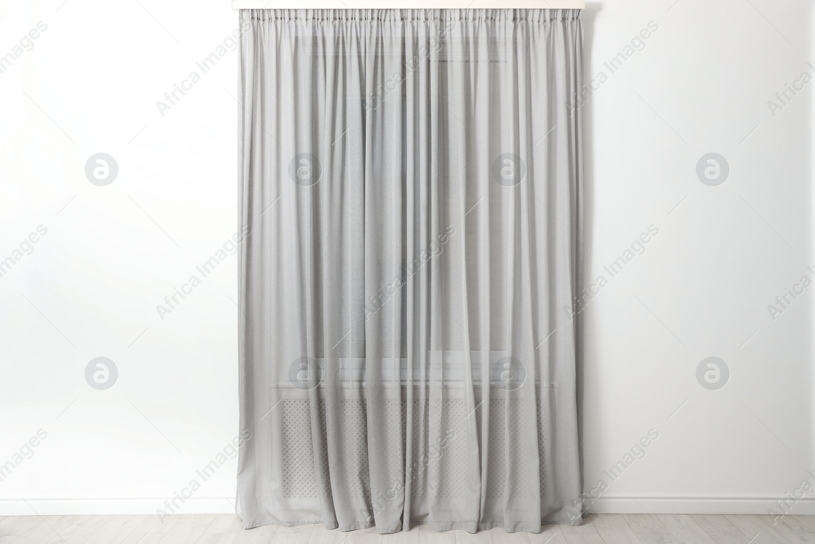 Photo of Modern window with beautiful curtains in room