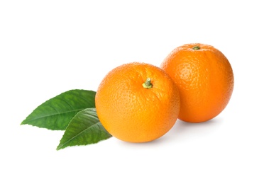 Fresh ripe oranges with green leaves on white background