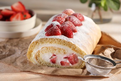 Photo of Delicious cake roll with strawberries and cream on table, closeup