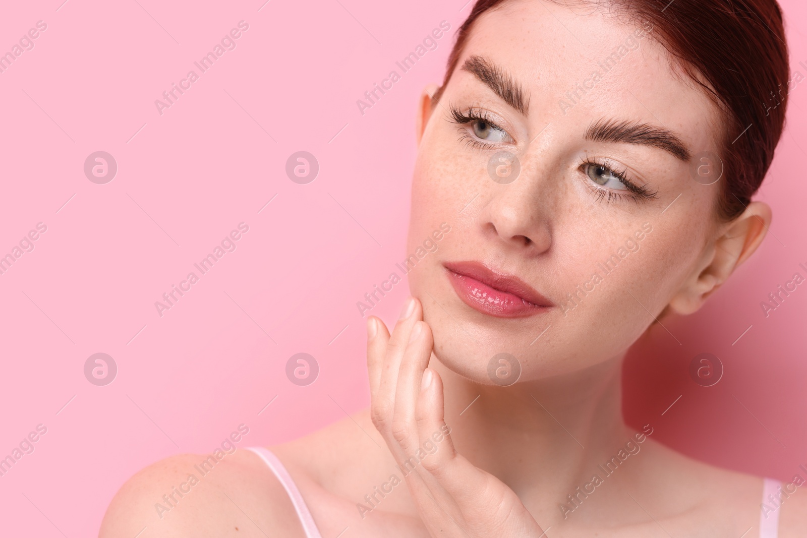 Photo of Portrait of beautiful woman on pink background, closeup. Space for text