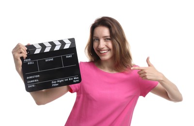 Making movie. Smiling woman with clapperboard showing thumb up on white background