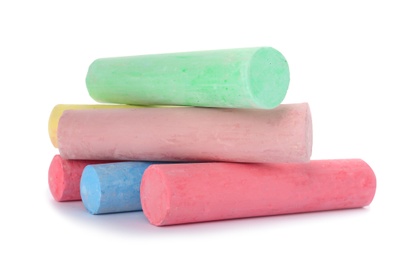 Color pieces of chalk on white background