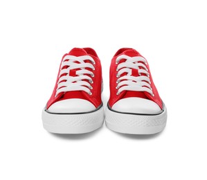 Photo of Pair of red classic old school sneakers on white background