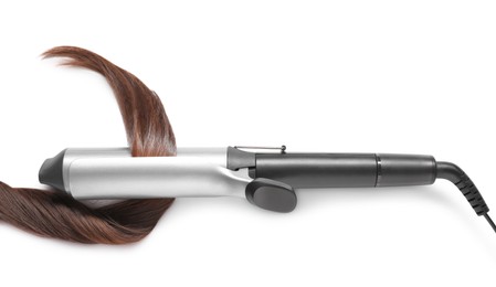 Photo of Curling iron with brown hair lock on white background