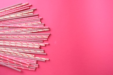 Photo of Many paper drinking straws on pink background, flat lay. Space for text