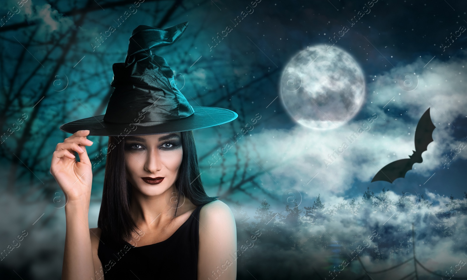 Image of Young girl dressed as witch in misty forest on full moon night. Halloween fantasy