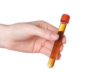 Photo of Woman holding test tube with brown liquid on white background, closeup